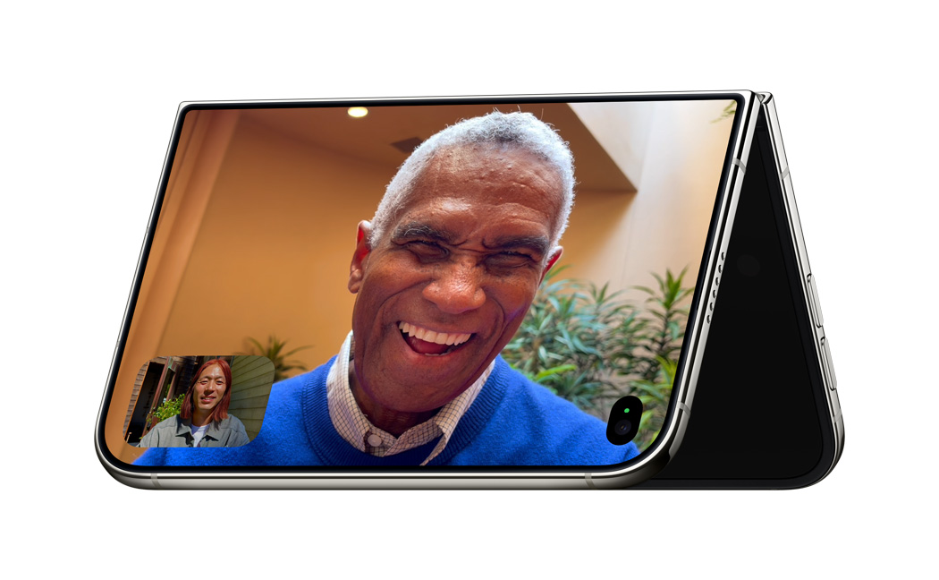 The iPhone Duo Is About to Break Your Responsive Design System iPhone Duo propped in a partially folded standing position during a FaceTime call.
