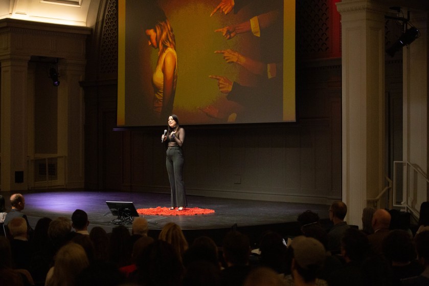 Ignite Seattle speaker presenting in front of a large visual slide.